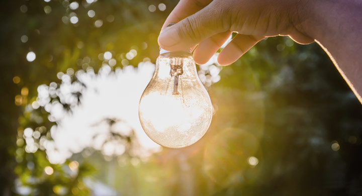 Man Holding Light bulb