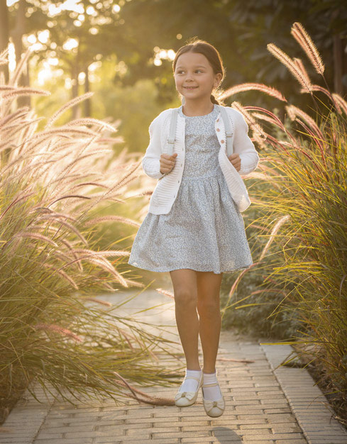 Little Girl Enjoying a Walk in the Park