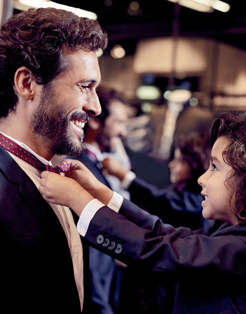 Little Happy Boy fix his father bow tie