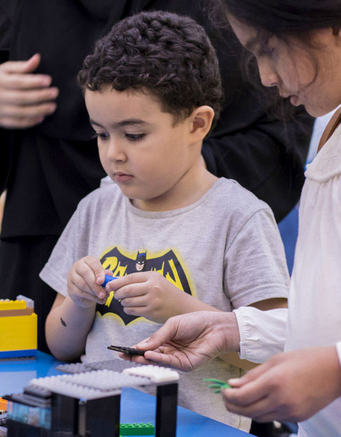 boy playing LEGO